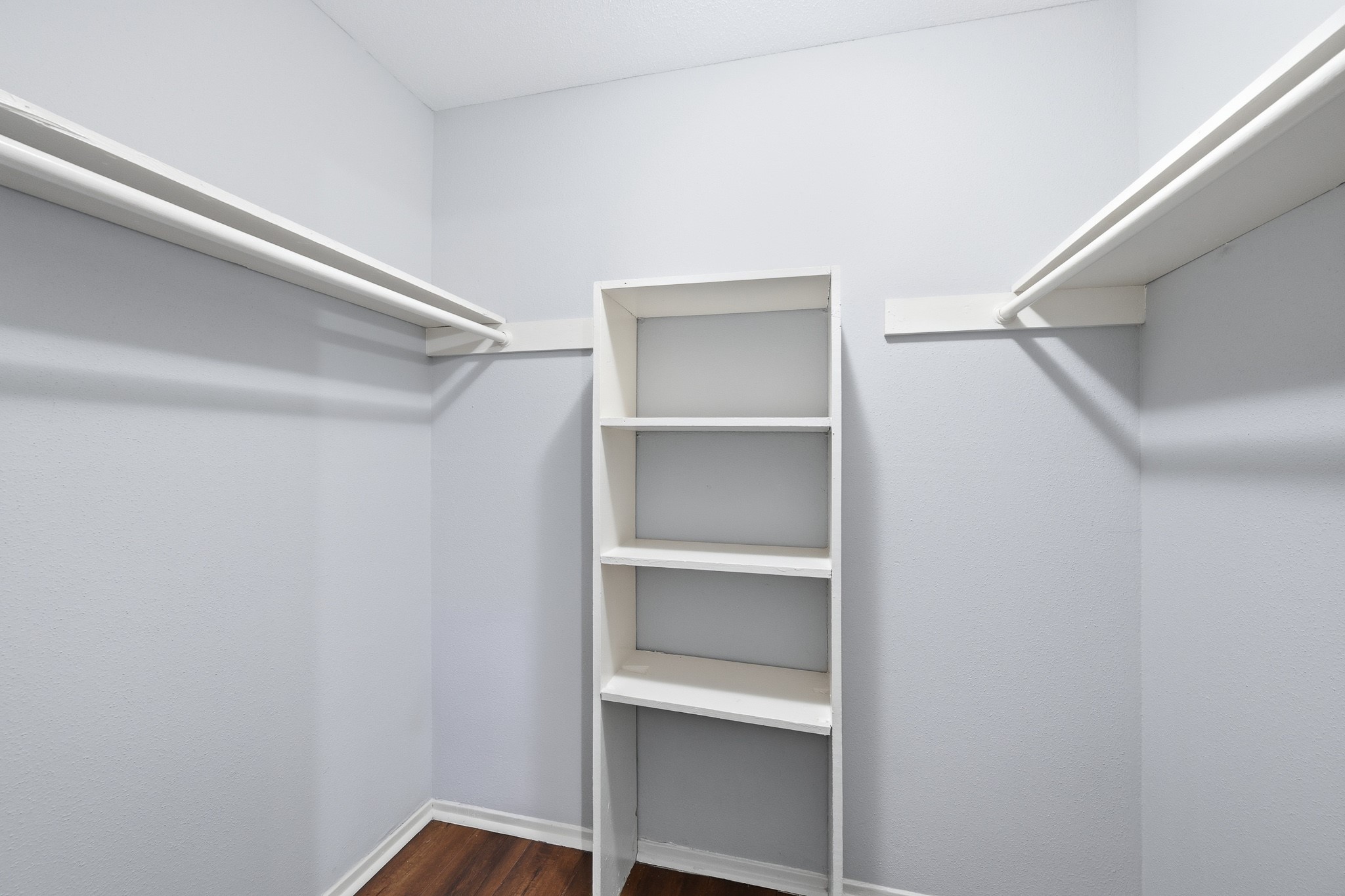 11550 Chimney Rock Road, Unit 133 Houston, TX 77035 - Photo 21 of 40 Spacious walk-in closet with ample shelving and hanging space, perfect for organized storage.
