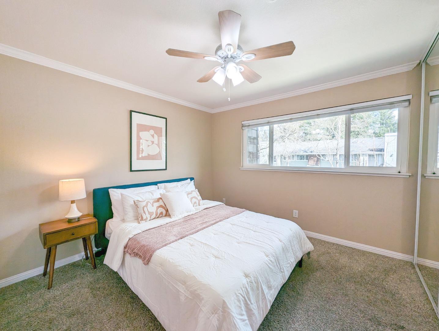 205 Compton Circle, Unit B San Ramon, CA 94583 - Photo 11 of 24 a bedroom with a bed and a chandelier