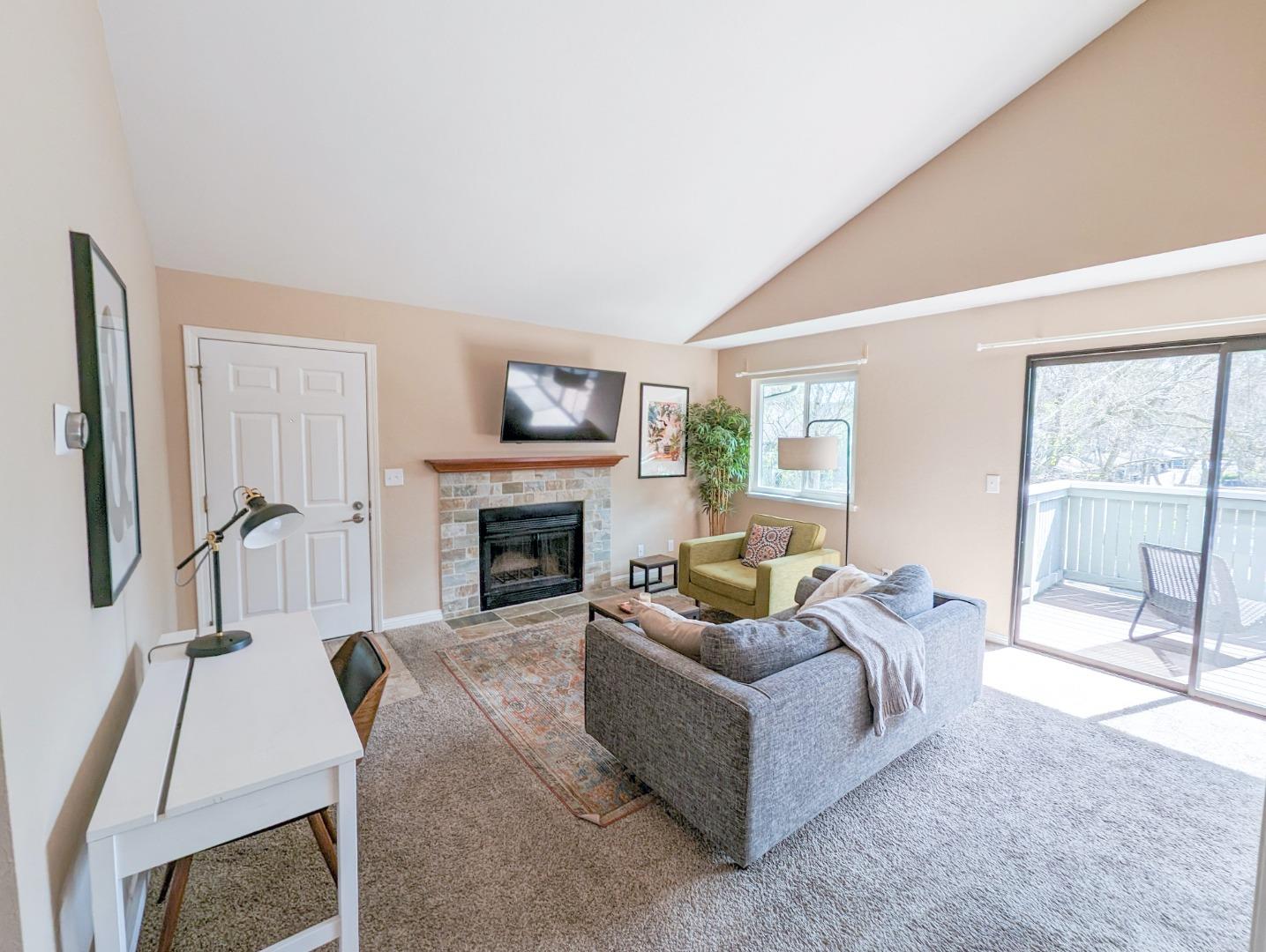 205 Compton Circle, Unit B San Ramon, CA 94583 - Photo 2 of 24 a living room with furniture a large window and a fireplace