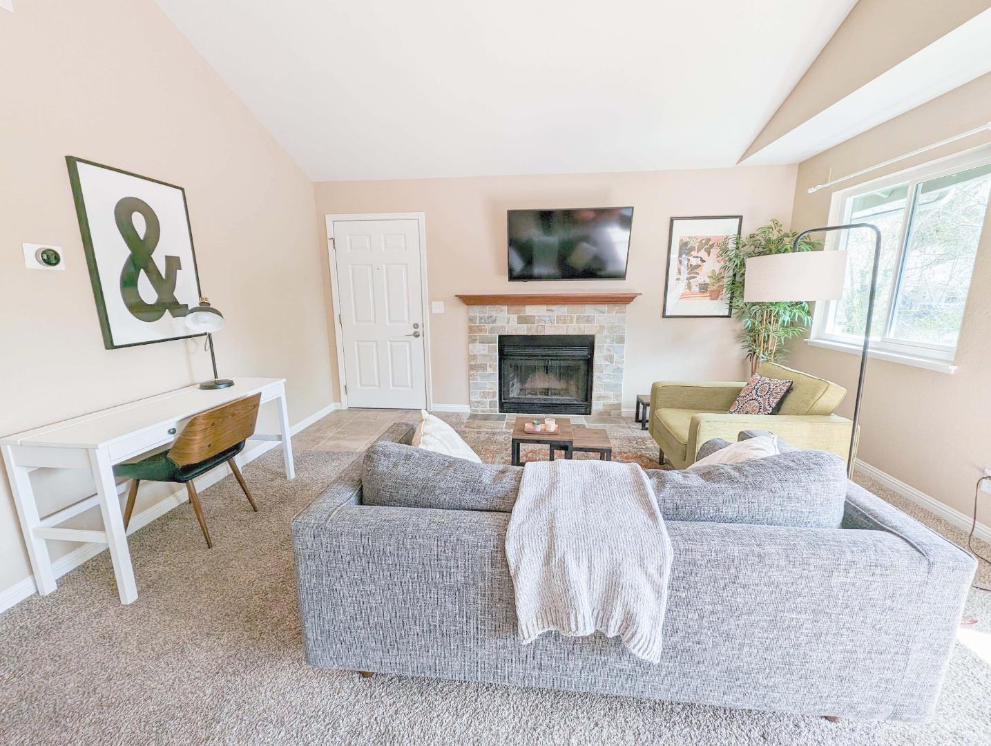 205 Compton Circle, Unit B San Ramon, CA 94583 - Photo 5 of 24 a living room with furniture and a fireplace