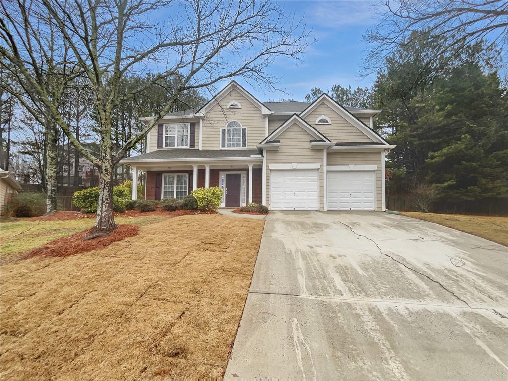 2208 Howell Farms Point Northwest Acworth, GA 30101 - Photo 1 of 1 a front view of a house with a yard and garage