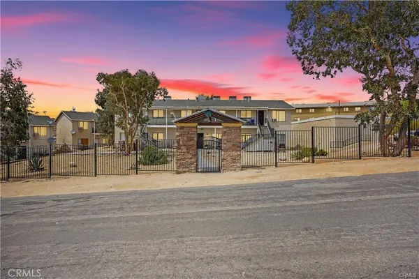 a view of a house next to a yard
