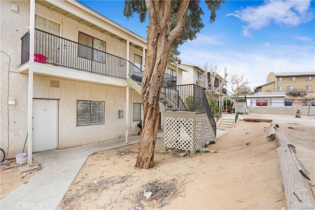 17802 Quantico Road Apple Valley, CA 92307 - Photo 11 of 21 a view of a street with a building in the background