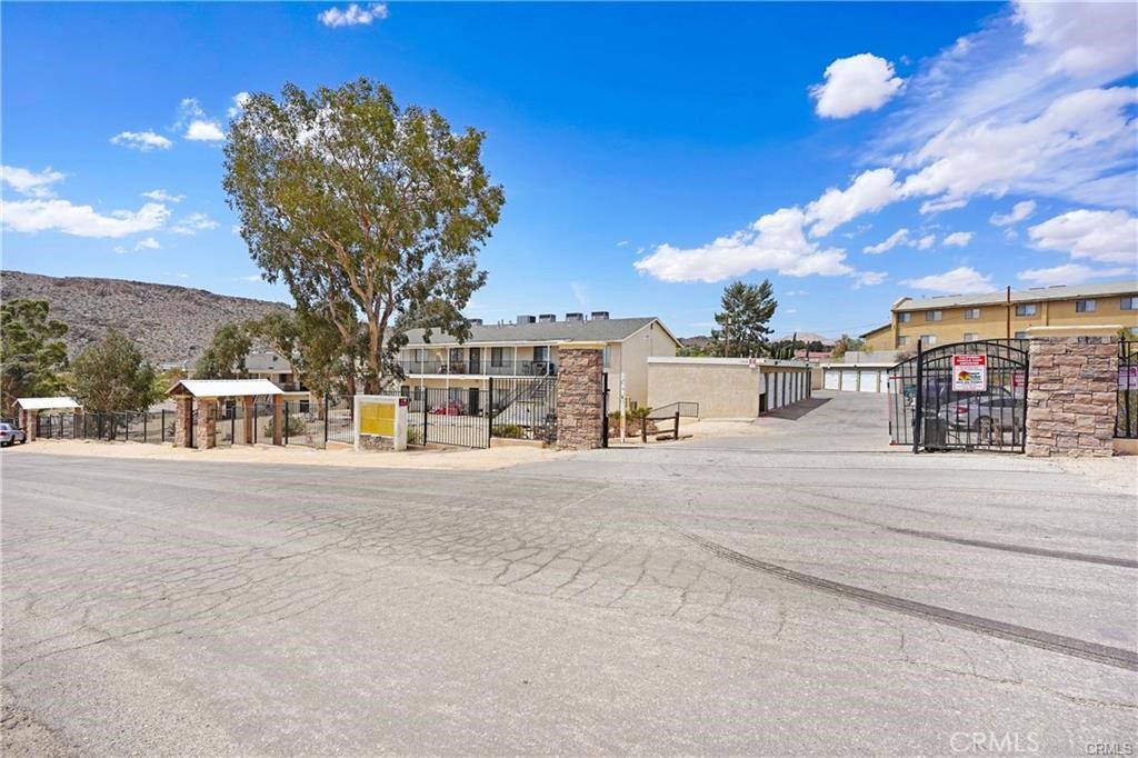 17802 Quantico Road Apple Valley, CA 92307 - Photo 16 of 21 front view of a house with a street