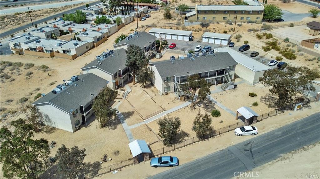 17802 Quantico Road Apple Valley, CA 92307 - Photo 17 of 21 an aerial view of a house with a yard and lake view