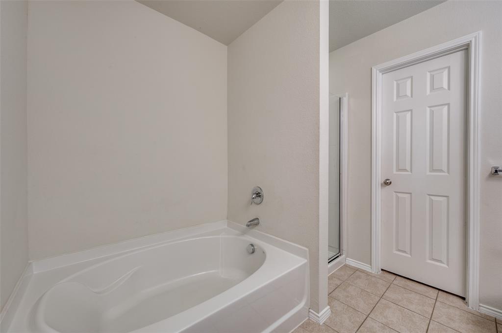 1420 Rivers Creek Lane Little Elm, TX 75068 - Photo 20 of 25 a white bath tub sitting next to a shower
