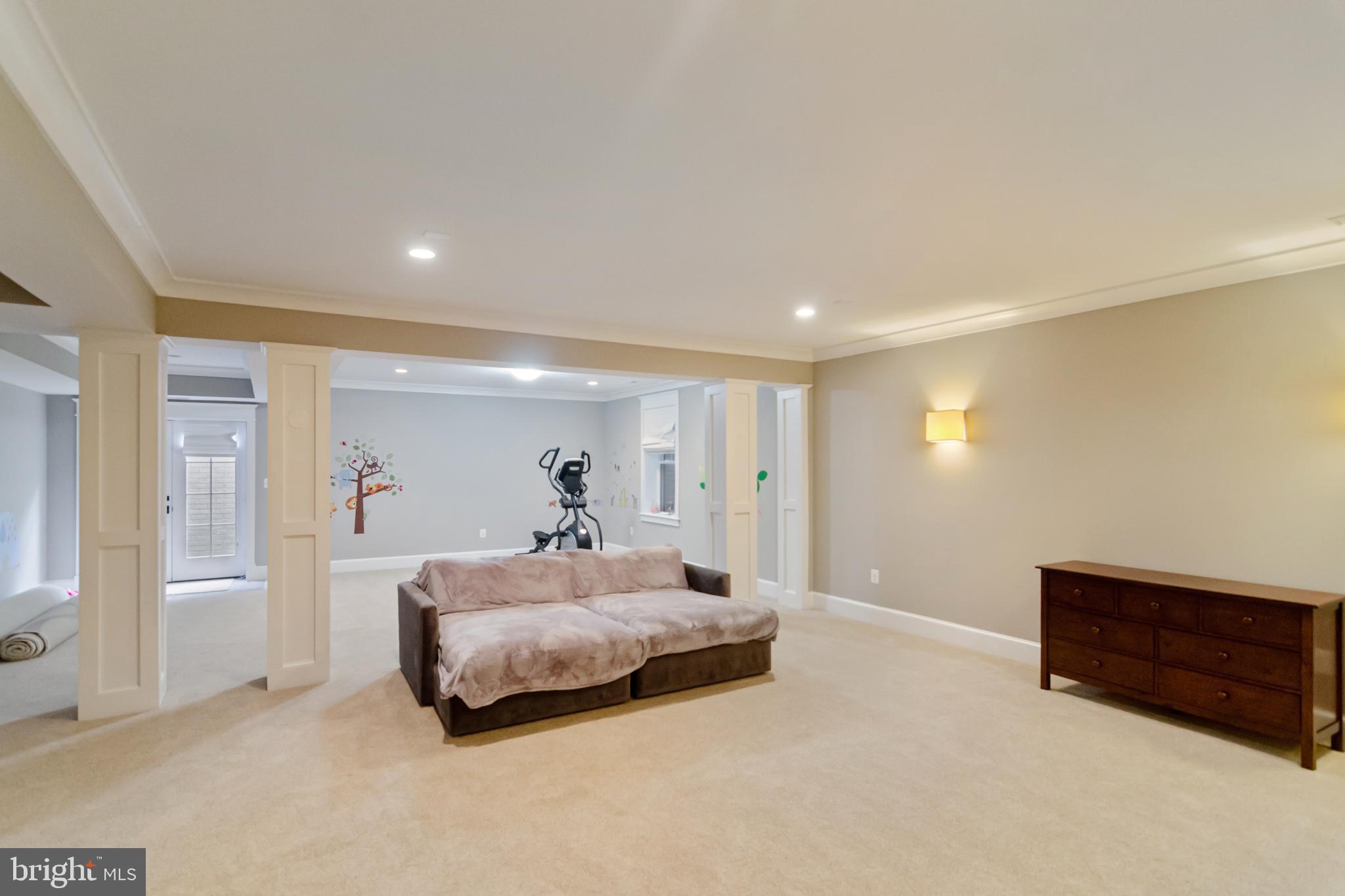 6801 Danforth Street McLean, VA 22101 - Photo 28 of 29 a spacious bedroom with a bed and wooden floor