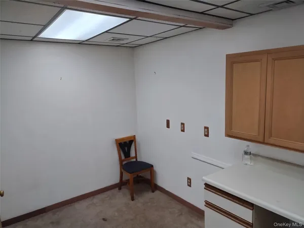 a view of room with racks on the wall