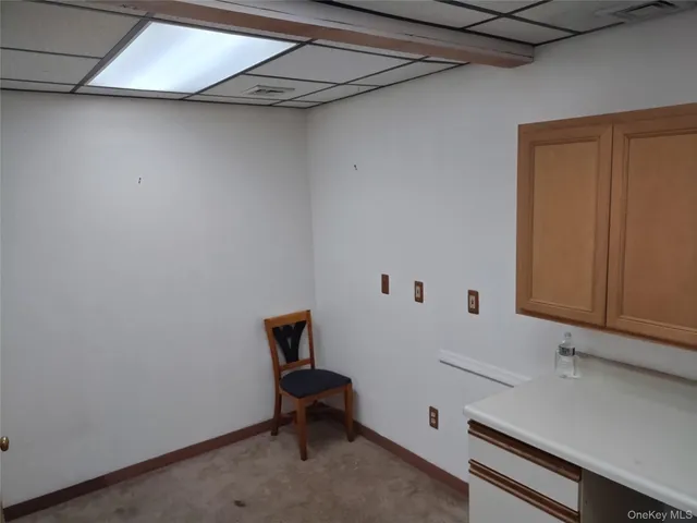 a view of room with racks on the wall