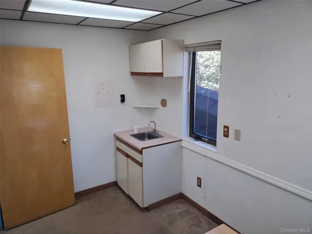 a kitchen with a stove and a microwave