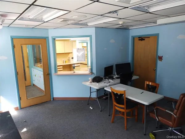 a workspace with furniture and a window