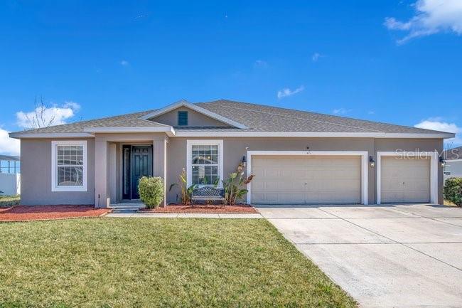 1422 Sharon Rose Trace Deltona, FL 32725 - Photo 1 of 42 front view of a house with a yard