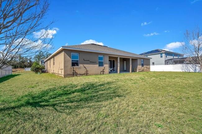 1422 Sharon Rose Trace Deltona, FL 32725 - Photo 11 of 42 a front view of a house with garden