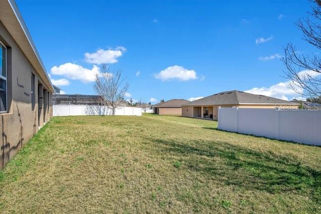 1422 Sharon Rose Trace Deltona, FL 32725 - Photo 12 of 42 a view of a house with a yard
