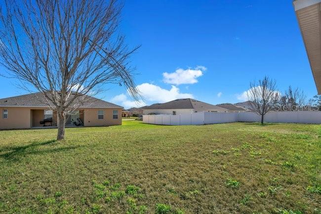 1422 Sharon Rose Trace Deltona, FL 32725 - Photo 13 of 42 a house view with a garden space