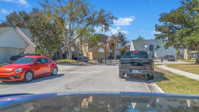 1422 Sharon Rose Trace Deltona, FL 32725 - Photo 14 of 42 a cars parked on the side of a street