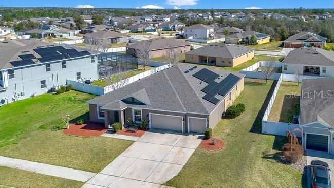 1422 Sharon Rose Trace Deltona, FL 32725 - Photo 16 of 42 an aerial view of a house with a garden