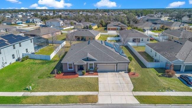 1422 Sharon Rose Trace Deltona, FL 32725 - Photo 17 of 42 a aerial view of a house with a yard