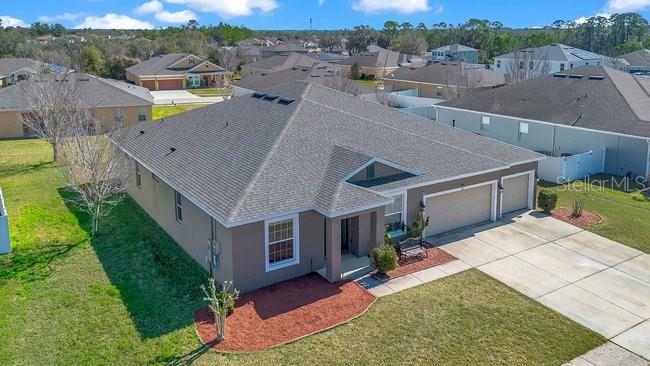 1422 Sharon Rose Trace Deltona, FL 32725 - Photo 18 of 42 a aerial view of a house with a yard