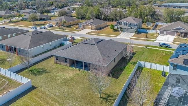 1422 Sharon Rose Trace Deltona, FL 32725 - Photo 20 of 42 an aerial view of a house with swimming pool and ocean view