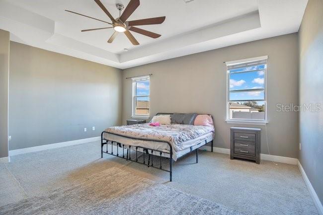 1422 Sharon Rose Trace Deltona, FL 32725 - Photo 27 of 42 a bedroom with a bed and a window