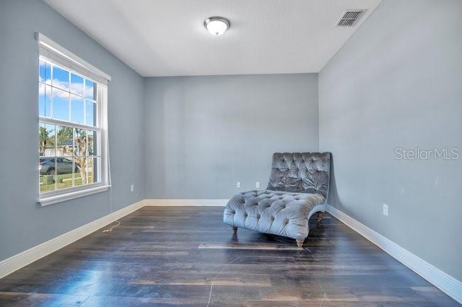 1422 Sharon Rose Trace Deltona, FL 32725 - Photo 40 of 42 a living room with furniture and a window