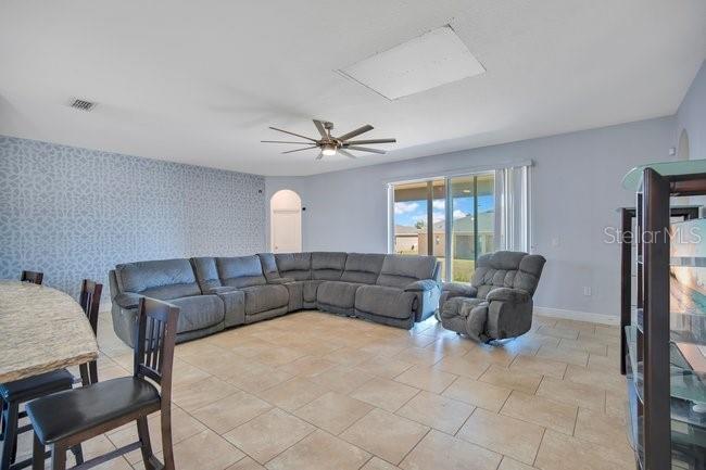 1422 Sharon Rose Trace Deltona, FL 32725 - Photo 5 of 42 a living room with furniture