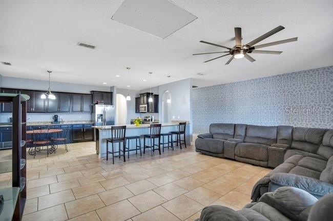 1422 Sharon Rose Trace Deltona, FL 32725 - Photo 6 of 42 a living room with furniture and kitchen view