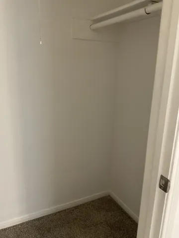 a bathroom with a granite countertop sink a toilet and bathtub