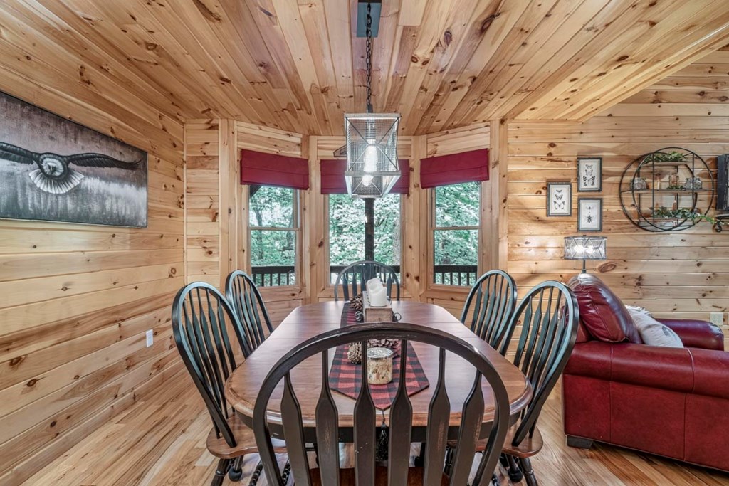115 Lakota Trail Blue Ridge, GA 30513 - Photo 7 of 49 a view of a dining room with furniture wooden floor and chandelier