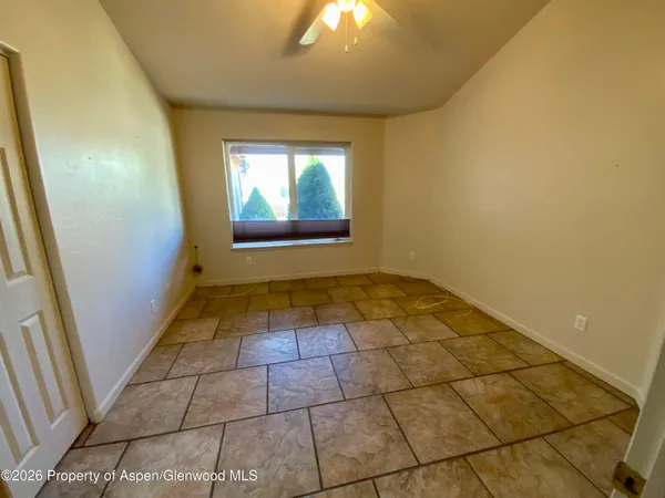 a view of an empty room and window