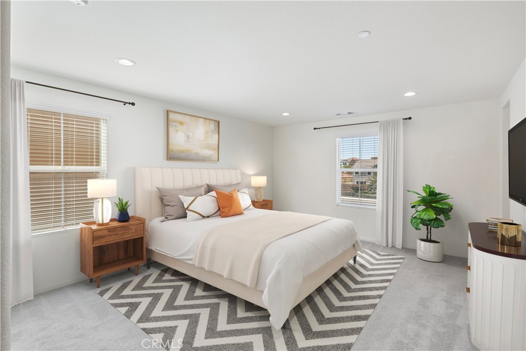 9605 Bonsai Lane Riverside, CA 92508 - Photo 14 of 41 a bedroom with a bed and a potted plant