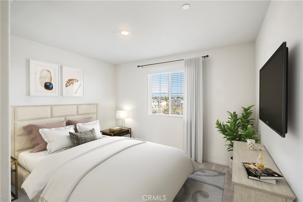 9605 Bonsai Lane Riverside, CA 92508 - Photo 18 of 41 a bedroom with a bed and a flat screen tv