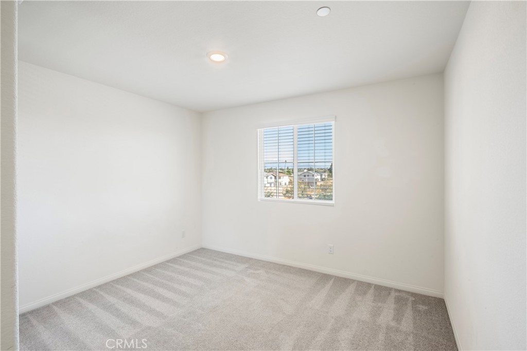 9605 Bonsai Lane Riverside, CA 92508 - Photo 19 of 41 an empty room with windows