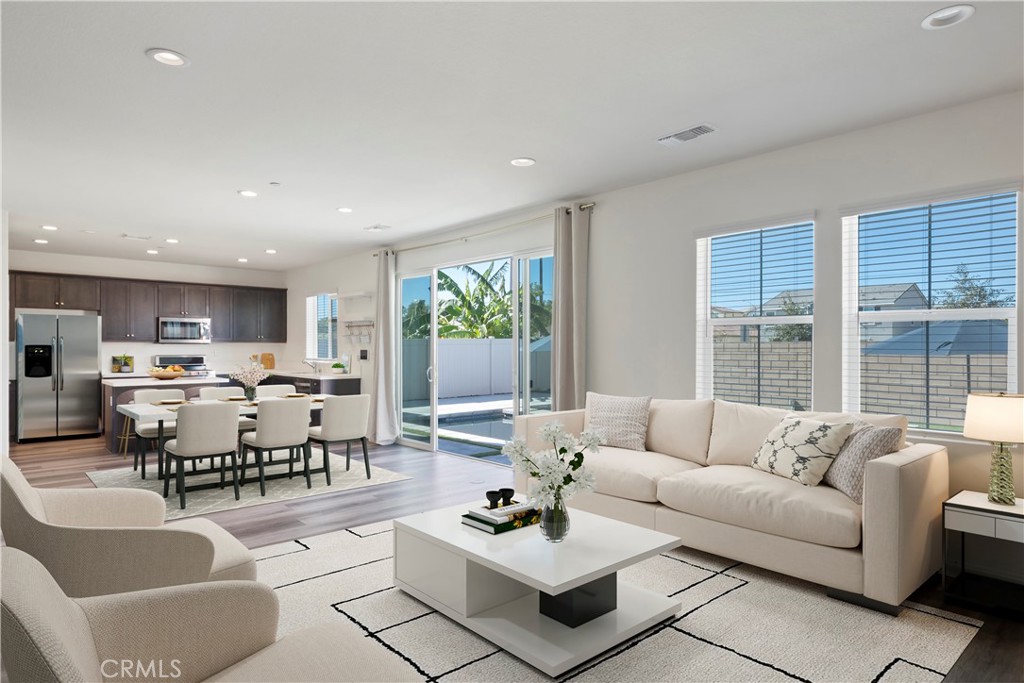 9605 Bonsai Lane Riverside, CA 92508 - Photo 3 of 41 a living room with furniture and a large window