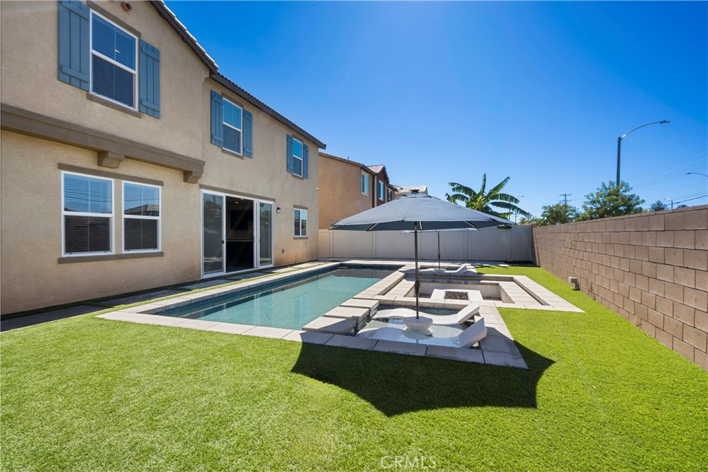 9605 Bonsai Lane Riverside, CA 92508 - Photo 33 of 41 a view of a house with backyard and sitting area