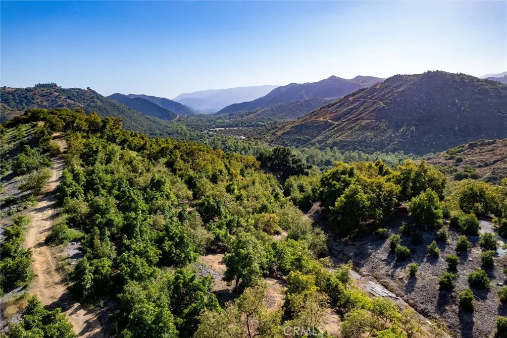 18 De Luz Road Temecula, CA 92590 - Photo 10 of 10 a view of a lush green hillside and a houses
