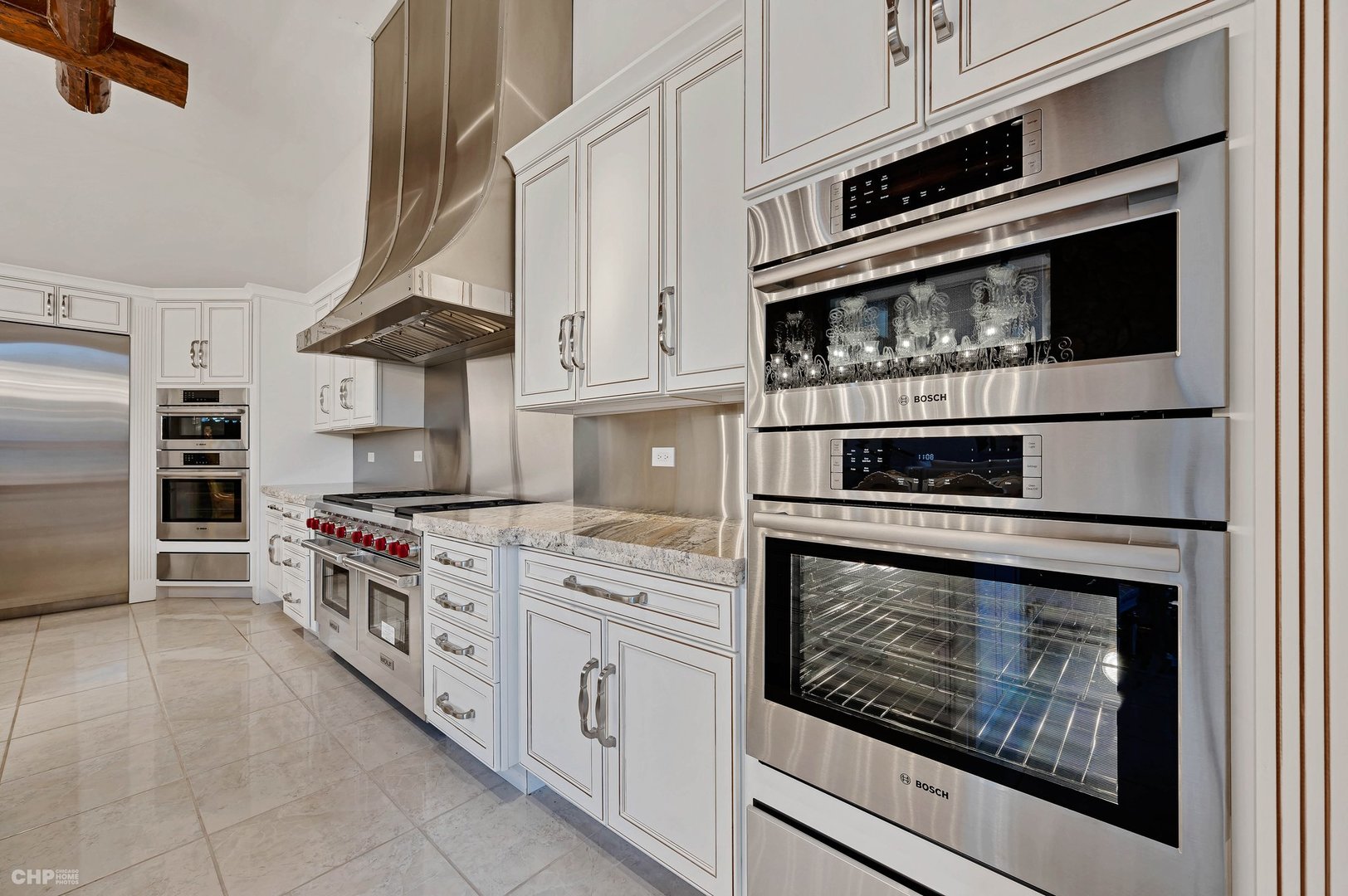 1 Maros Lane Olympia Fields, IL 60461 - Photo 13 of 50 a kitchen with stainless steel appliances granite countertop a stove microwave and cabinets