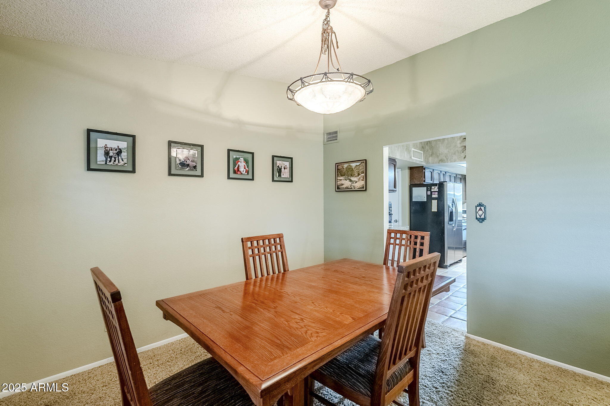 1222 East Louis Way Tempe, AZ 85284 - Photo 15 of 39 a view of a dining room with furniture and wooden floor