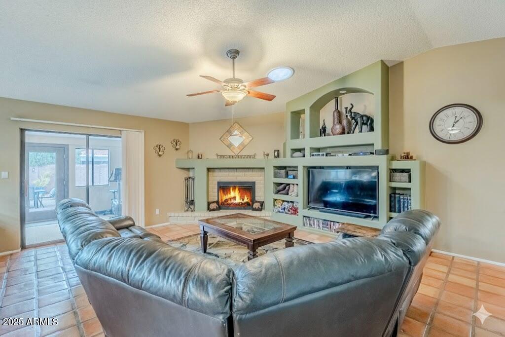 1222 East Louis Way Tempe, AZ 85284 - Photo 17 of 39 a living room with furniture and a fireplace