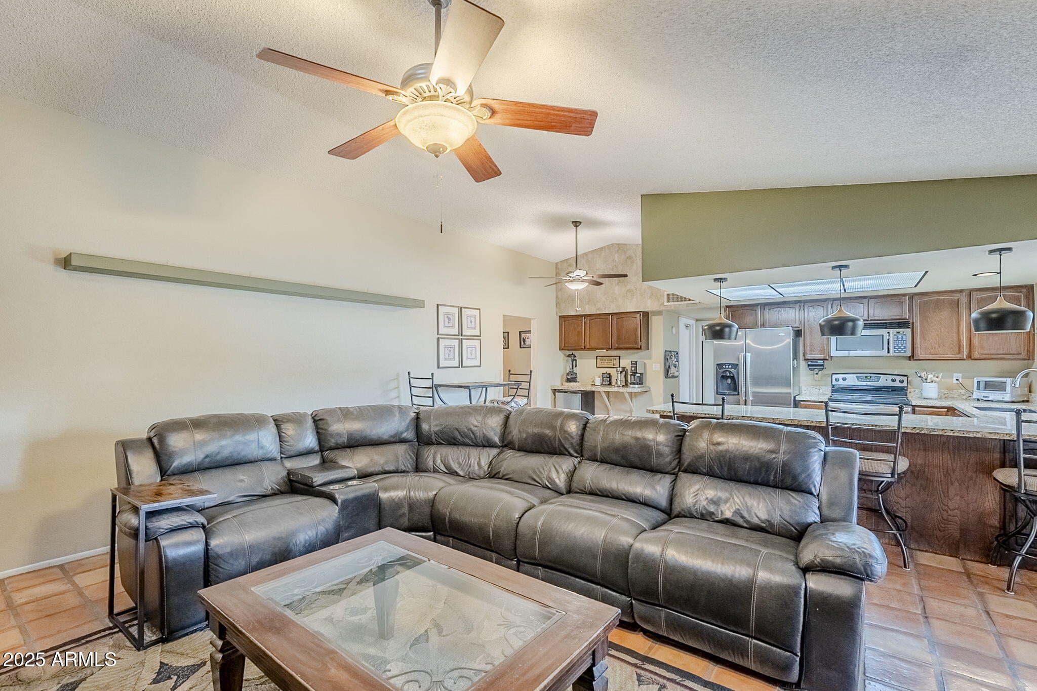 1222 East Louis Way Tempe, AZ 85284 - Photo 19 of 39 a living room with furniture a ceiling fan and a rug