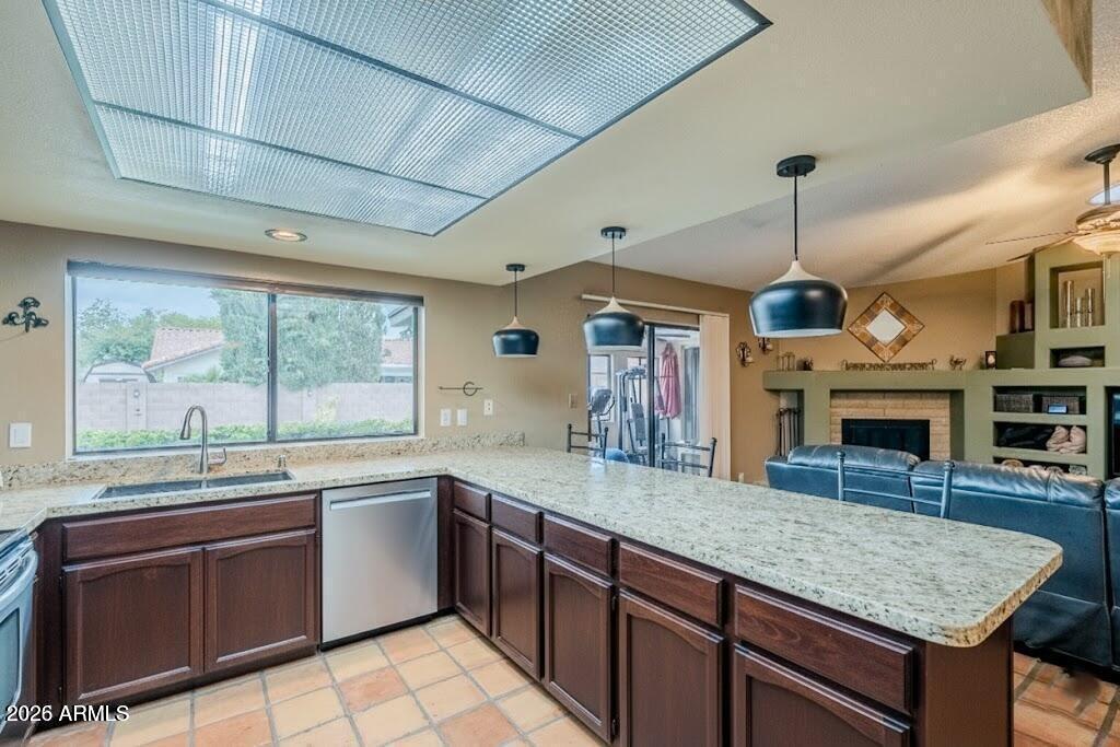1222 East Louis Way Tempe, AZ 85284 - Photo 20 of 39 a kitchen with stainless steel appliances granite countertop a sink a stove and a wooden floors