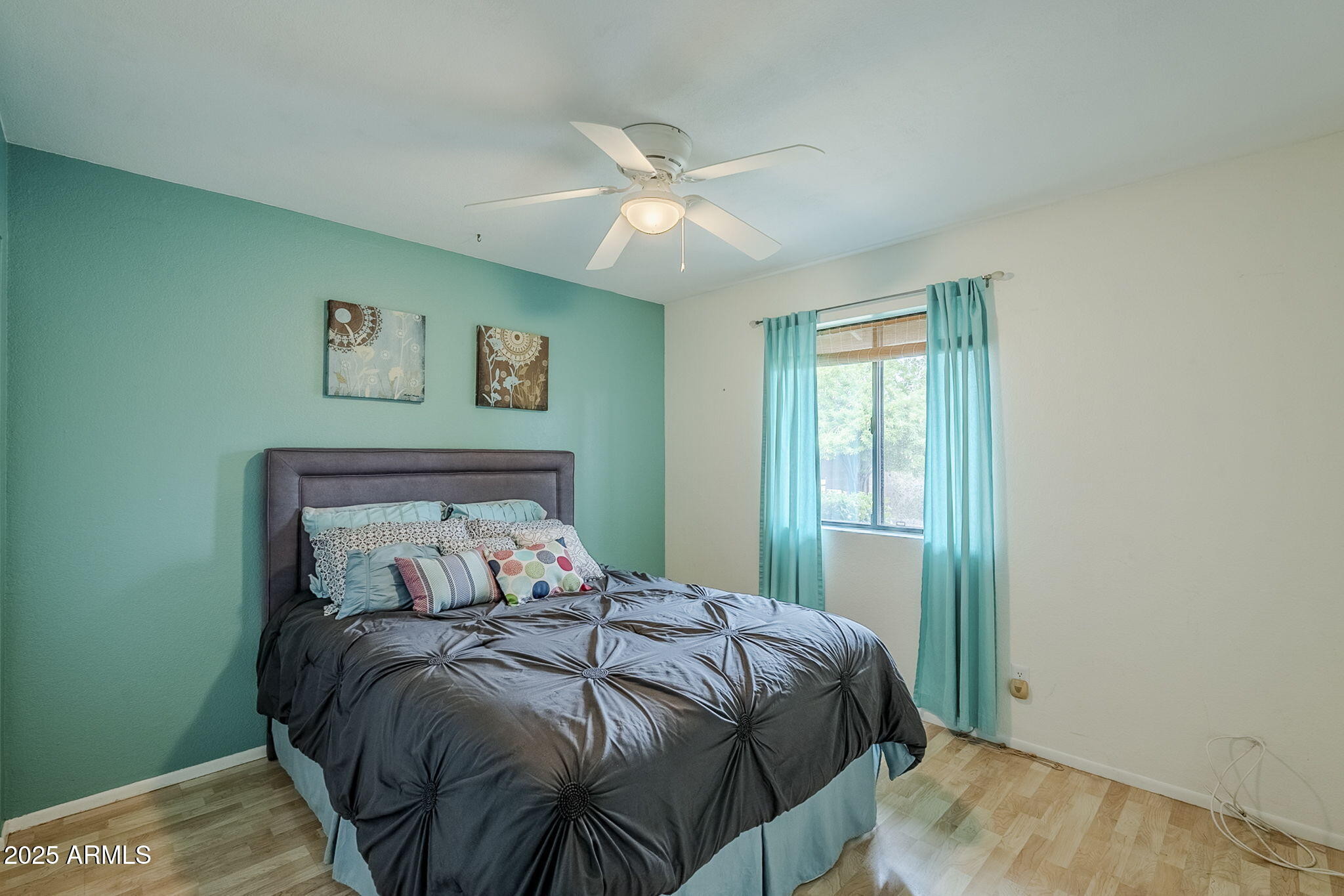 1222 East Louis Way Tempe, AZ 85284 - Photo 26 of 39 a bed sitting in a bedroom next to a window
