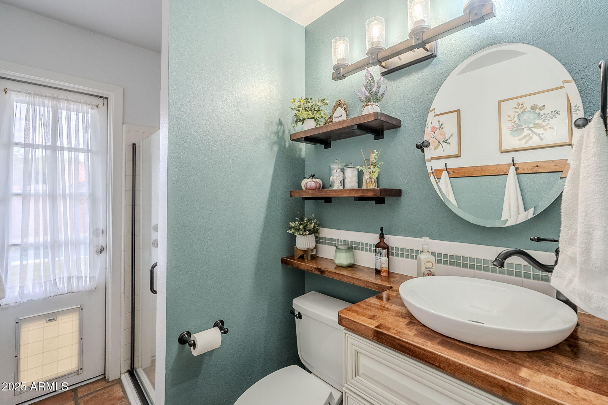 1222 East Louis Way Tempe, AZ 85284 - Photo 27 of 39 a bathroom with a toilet a sink and mirror