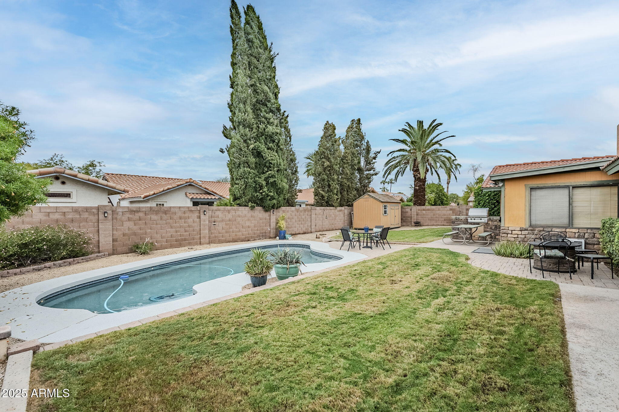 1222 East Louis Way Tempe, AZ 85284 - Photo 36 of 39 a swimming pool with outdoor seating and yard