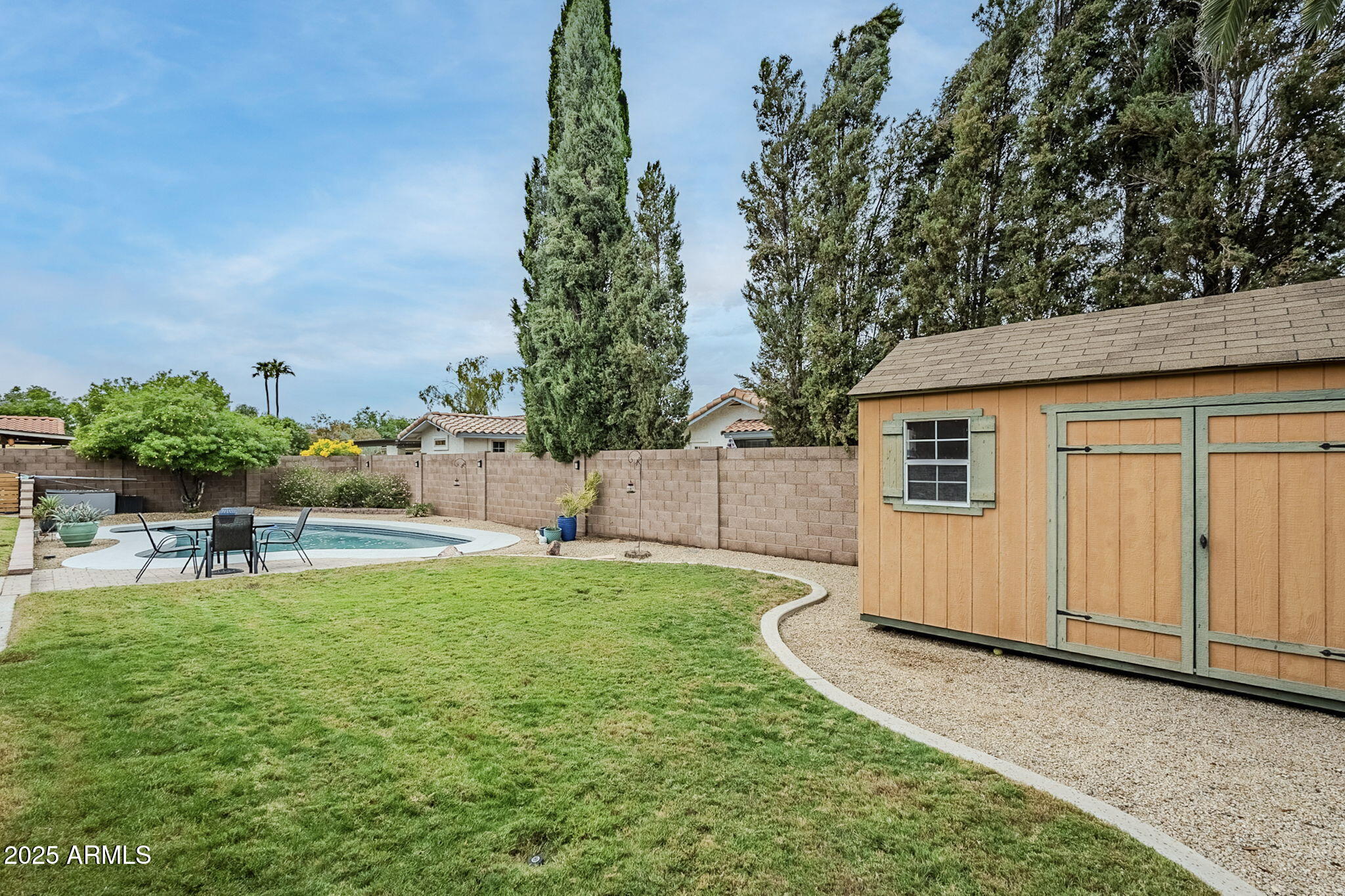 1222 East Louis Way Tempe, AZ 85284 - Photo 38 of 39 a view of a backyard with plants and a patio