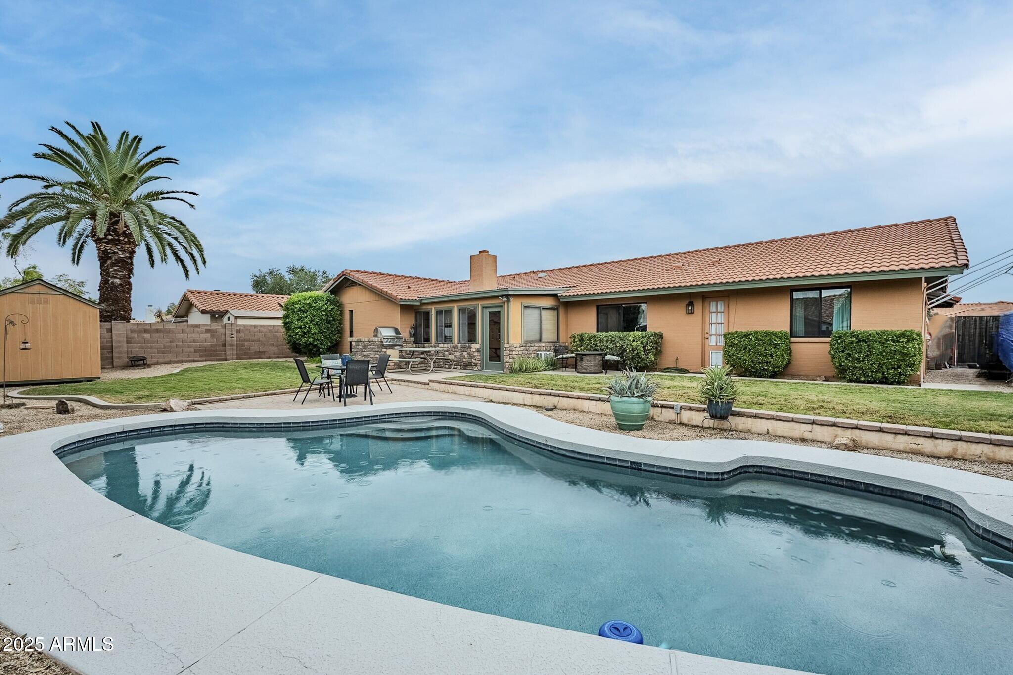 1222 East Louis Way Tempe, AZ 85284 - Photo 8 of 39 a view of house with swimming pool outdoor seating