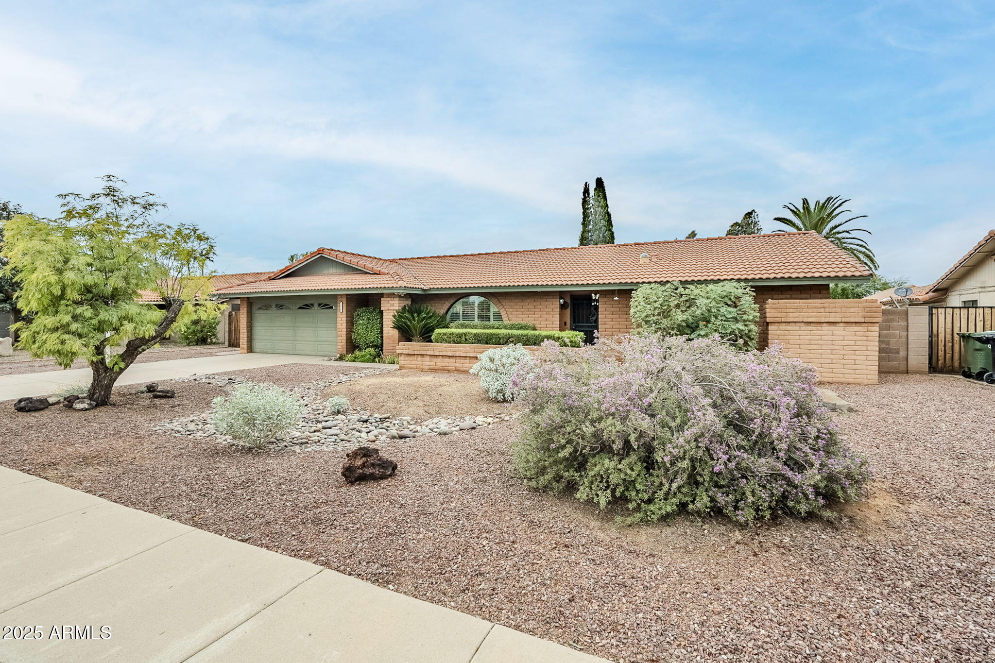 1222 East Louis Way Tempe, AZ 85284 - Photo 9 of 39 a front view of a house with a yard