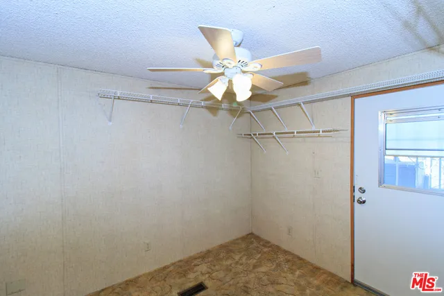 a view of a small space with a fan