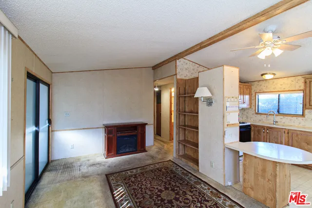 a kitchen with stainless steel appliances granite countertop a refrigerator and a stove